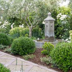 Garden With Gray Stone Fountain