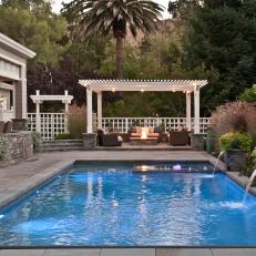 White Pergola and Pool With Fountains