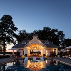 Waterfront Estate with Pool House at Night