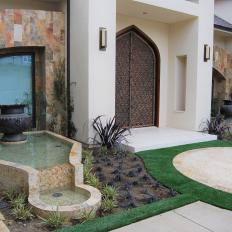Backyard With Small Garden and Water Fountain