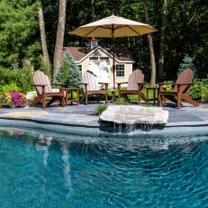 Pool and Brown Adirondack Chairs