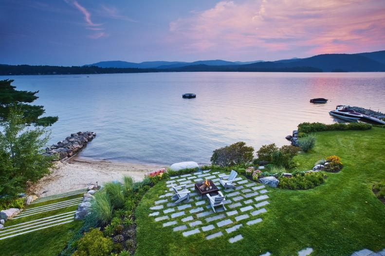 This breathtaking view of a lakeside backyard showcases how spacious the area is.