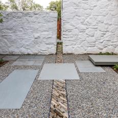 Zen Garden With White Stone Wall