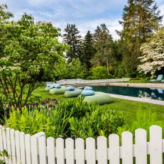 Pool Area With White Picket Fence
