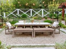 Outdoor Dining Table and White Fence