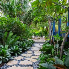 Tropical Home With Stone Walkway