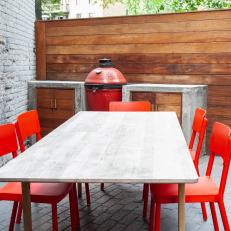 Outdoor Dining Area With Red Chairs