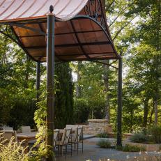 Outdoor Dining Area With Copper Pergola