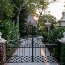 Iron Gate Leading to Traditional Style Home