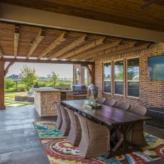 Brick Porch With Colorful Rug