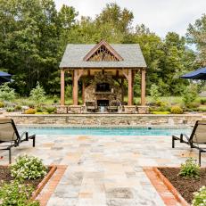 Poolside Pavilion With Stone Fireplace
