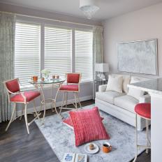 White and Gray Breakfast Nook With Red Chairs