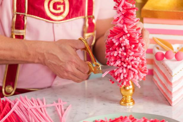After the chenille stem tree is complete, fill in any bare spots with more stems and then use scissors to trim up any uneven sides and make sure the piece is tree-shaped. Fluff the stems and spread them apart if there are any bunched closely together.