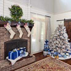 Flocked Christmas Tree and Decorated Fireplace