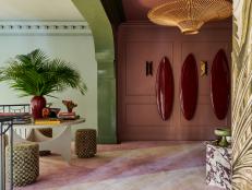 Inspired by the film sets of Hong Kong director Wong Kar-wai and his "dreamy moodiness" designer Christina Kim went for drama in her design. As she says "it's a big house with a big staircase and I needed a big gesture." She brought that grand gesture into the space with a custom carpet with waves of lavender throughout.