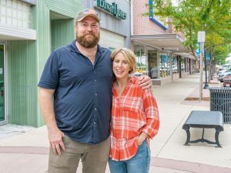 As seen on Home Town Takeover, Ben and Erin Napier pose for a photo in downtown Fort Morgan, Colorado.