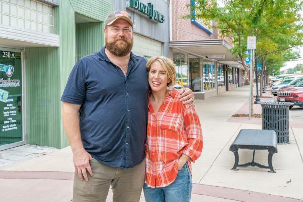 As seen on Home Town Takeover, Ben and Erin Napier pose for a photo in downtown Fort Morgan, Colorado.