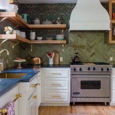 Green Kitchen With Open Shelving, White Cabinets and a Blue Countertop