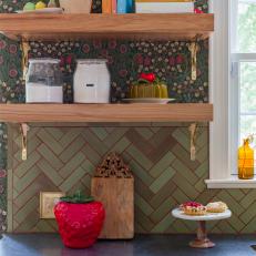 Open Kitchen Shelves with Books, Canisters and Strawberry Collectibles