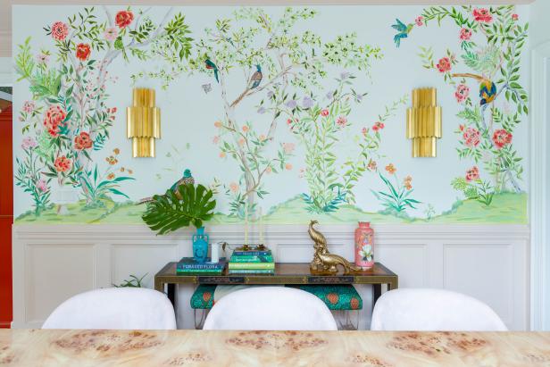 A hand-painted floral mural on the top half of a dining room wall