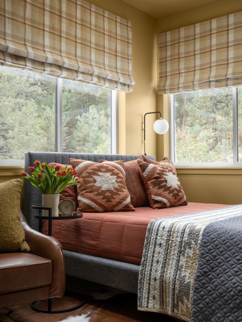 Gold Bedroom With Orange Bed Linens