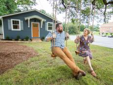 As seen on HGTV’s Hometown, Ben and Erin Napier share a moment on the swings Ben built in his workshop for the Everett house.