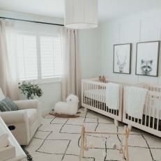 White Transitional Nursery With Wood Toy