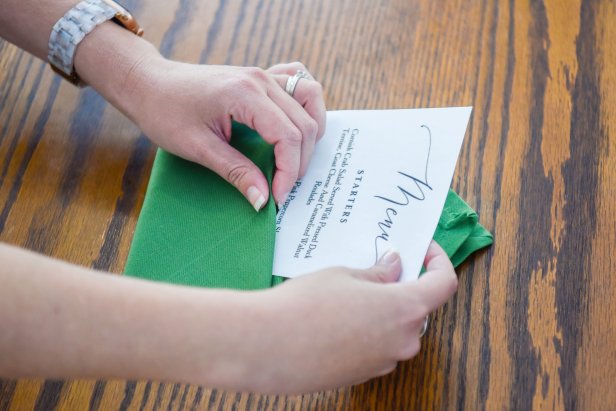 For the final step in creating this envelope napkin, slide your holiday dinner menu inside.