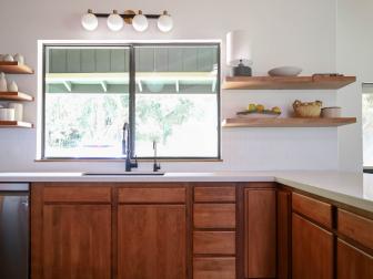 Kitchen With Wood Cabinetry and Shelving