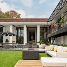 Black and White Contemporary Backyard With Awning