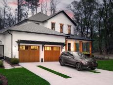 The large driveway with added strips of landscaped greenery, provides a welcome entry to HGTV Smart Home 2022.