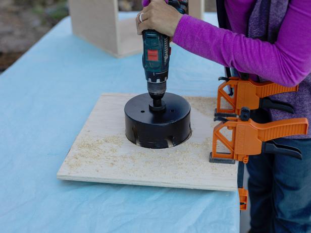 Use a 6” hole saw bit attached to a drill to create a circular opening on the front piece so your cat can easily go in and out of the hideaway.