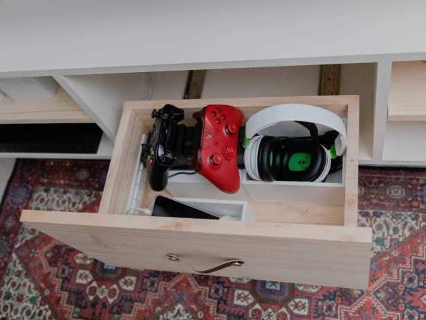 The drawer of this DIY shelving unit cleverly holds a built-in power strip. It’s the perfect spot to charge phones, tablets and other gadgets while keeping messy cords contained.