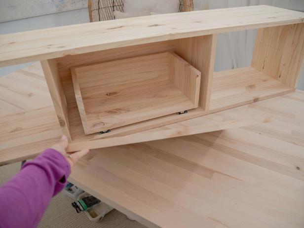 Place the drawer into the unit and snap the drawer slides back together.
