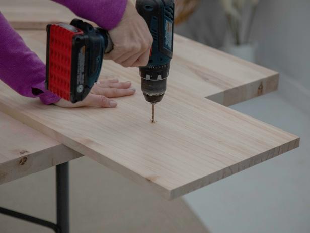 The 11-3/4&quot; x 20&quot; piece will be the front of the drawer. Center and mark the position of a cabinet handle on the wood. Drill holes and screw into place.