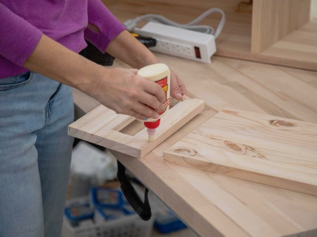 Add wood glue and attach the drawer side piece you just modified to the 9-3/4&quot; x 16&quot; base.