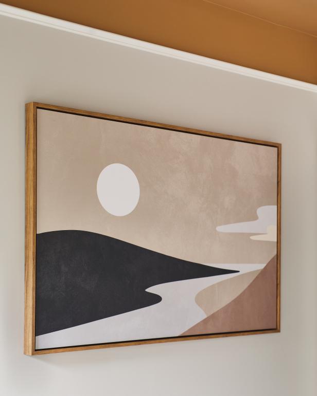 A neutral landscape painting in the guest bedroom is an artistic nod to the coastal North Cape Fear River locale of HGTV Smart Home 2022 and plays off the room’s color scheme. 