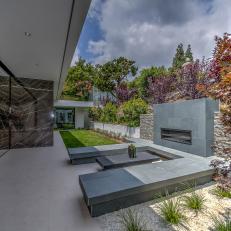 Modern Landscape Design Featuring Outdoor, Gray Stone Fireplace With Built-In Seating and Japanese Maple Trees