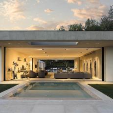 Modern, White Outdoor Living Space With Comfortable Seating and High-Impact Artwork 