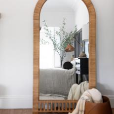 Brown Oval Mirror in Bedroom
