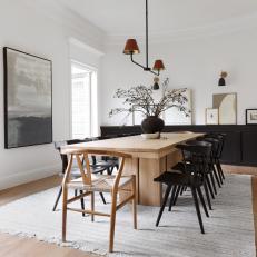 Contemporary Dining Room With Black Paneling
