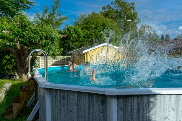 Stockholm Sweden - July 12, 2018: Children jump into the pool with a splash. Circa Stockholm