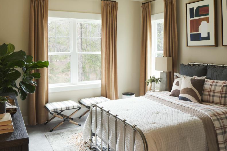 “I wanted this room to be neutral, restful, emulate sand with a touch of sea in here,” said designer Tiffany Brooks. Soft tones of white, tan, brown and black bring a soothing feel to this relaxing space.