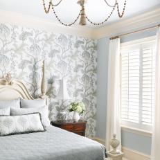 Green and White Cottage Bedroom With Chandelier