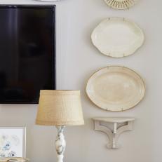 Transitional, Neutral Living Room With a Ceramic Plate Wall Display and Beautiful Blend of Textures 