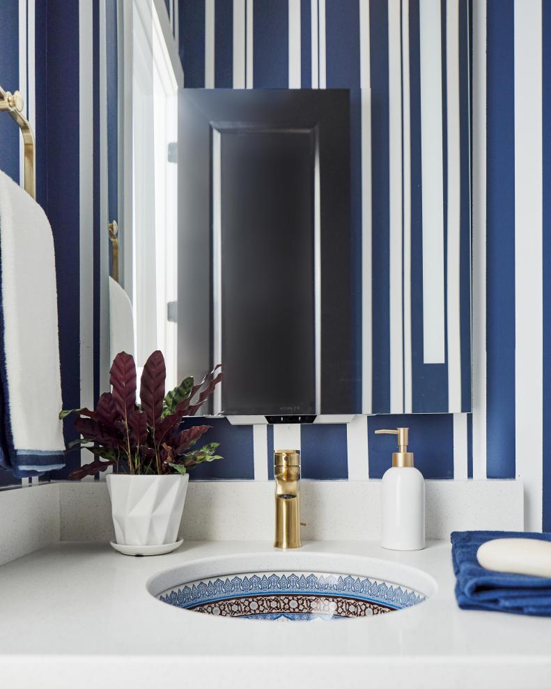 A smart mirror above the vanity with optimally bright, shadowless light includes virtual assistant technology, that offers an easy hands-free way to adjust the lights, play music, get the weather, and more.