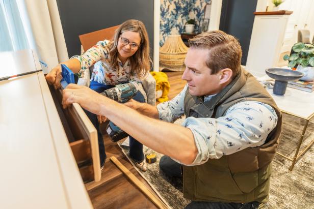 As seen on HGTV’s Renovation Goldmine, hosts Meg and Joe Piercy put the finishing touches on a family room cabinet before revealing the space to Jen and Melanie Mihalek. (Reveal Day)