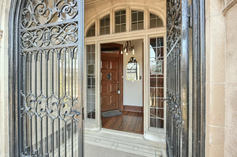 Arched iron doors that lead to stone entrance to townhouses. 