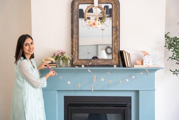 Woman Decorates Blue Fireplace Mantle with Salt Dough Garland