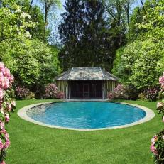 Round Swimming Pool With Lawn and Pool House 